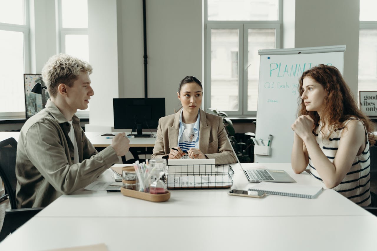 A diverse group of professionals having a collaborative meeting in an office setting.